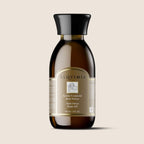 Frasco de vidrio de 10ml con etiqueta elegante, mostrando el Preparado de Aceites Esenciales Anti-Stress de Alqvimia, rodeado de ingredientes naturales.